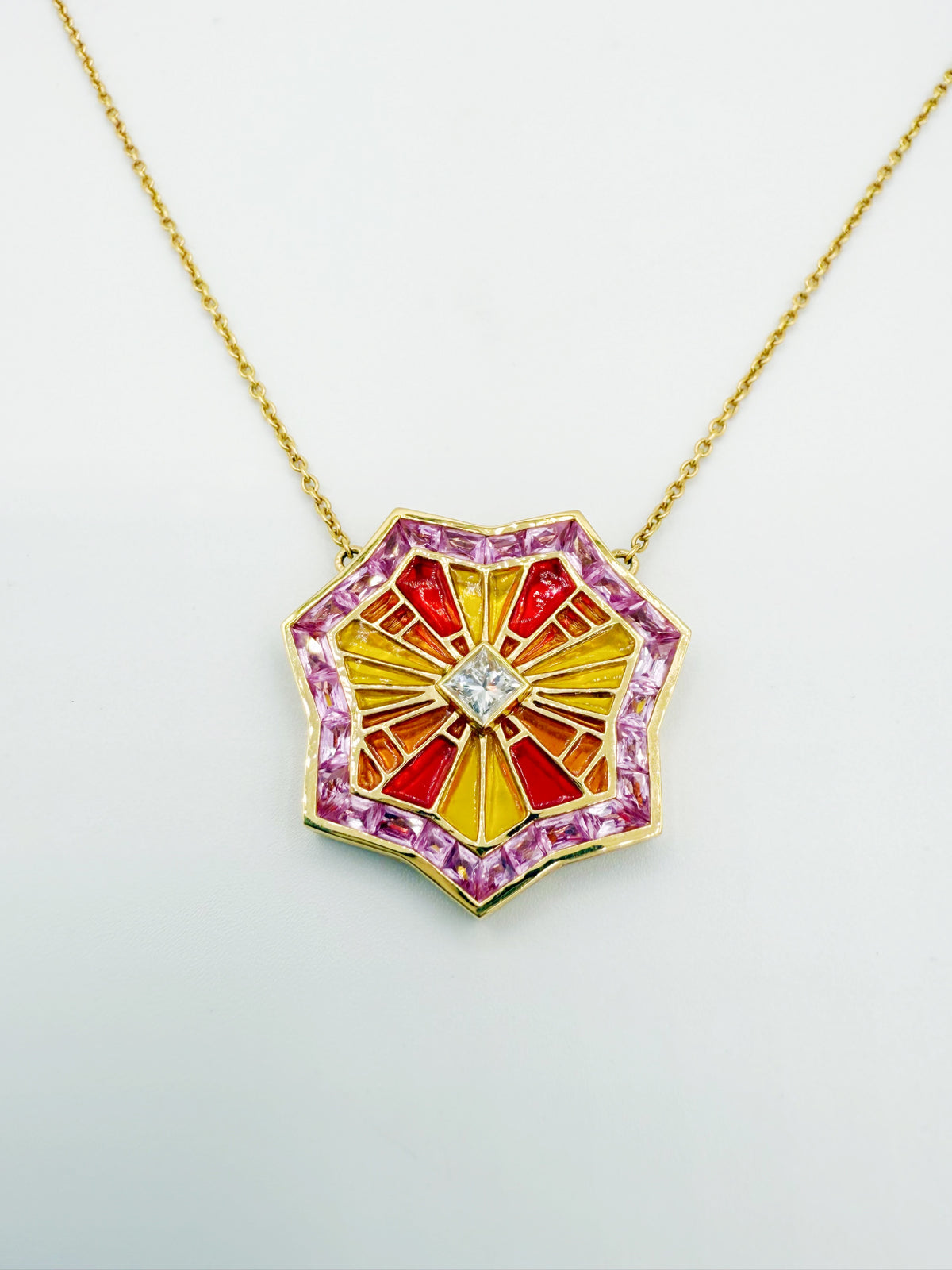 ARK Awakenings Collection OM necklace displayed on 18 inch gold chain