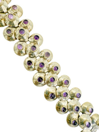 Detail view of natural amethyst stones on vintage Mexican silver bracelet