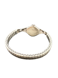 Back view of Art Deco stepped diamond shoulders on white gold Benrus wristwatch, showing 14K GOLD stamp on caseback.