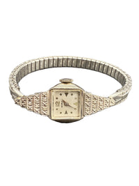 1930s Benrus Art Deco ladies wristwatch in solid 14K white gold with stepped diamond-set shoulders and original dial.