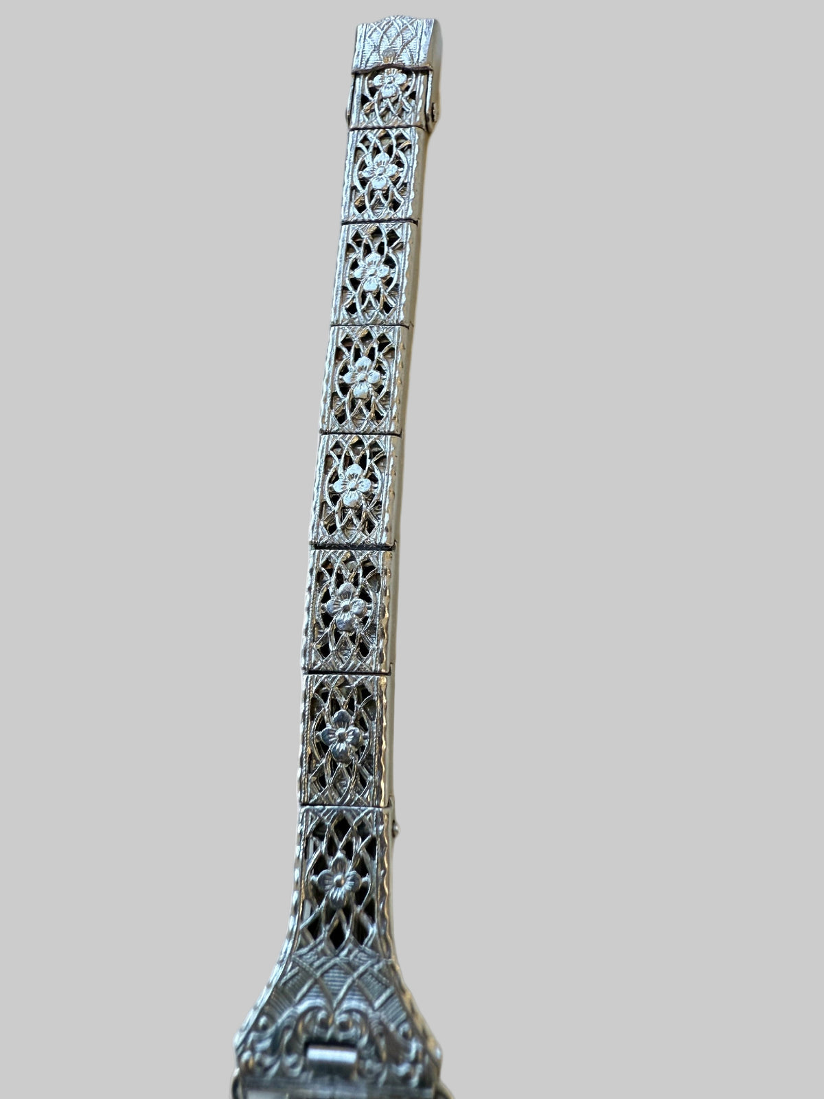 Dogwood flower engraved shadow-box panel bracelet on 1920s Bulova ladies watch