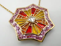 Detail of calibré-cut pink sapphire halo and square diamond accent on ARK necklace