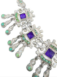 Detail of turquoise cabochons and pyramid-cut amethyst in Matl necklace