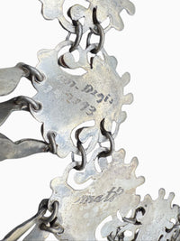 Engraved Matl and M Regis marks close-up detail