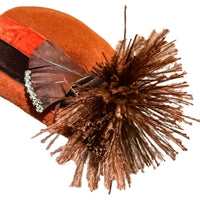 Close-up of Schiaparelli Paris hat feathers and rhinestone detail