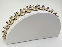 Profile view of domed silver links with amethyst cabochons