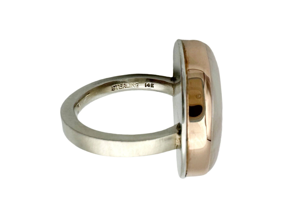 Side view of the ring showing the stamps of STERLING and 14K on the inside of the band