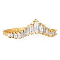 Angled close-up of Artemer 18K gold baguette diamond tiara wedding band