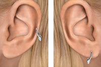 Close-up of an ear wearing Maria Tash White Gold Hoop with Opal Spike.