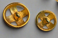 Back of two gold buttons.