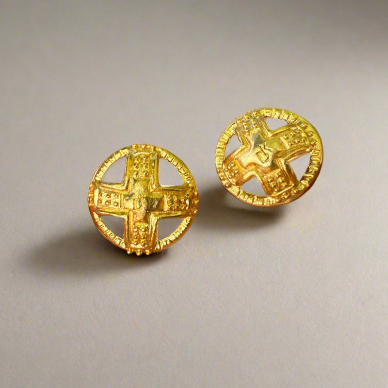 Two gold-toned domed buttons