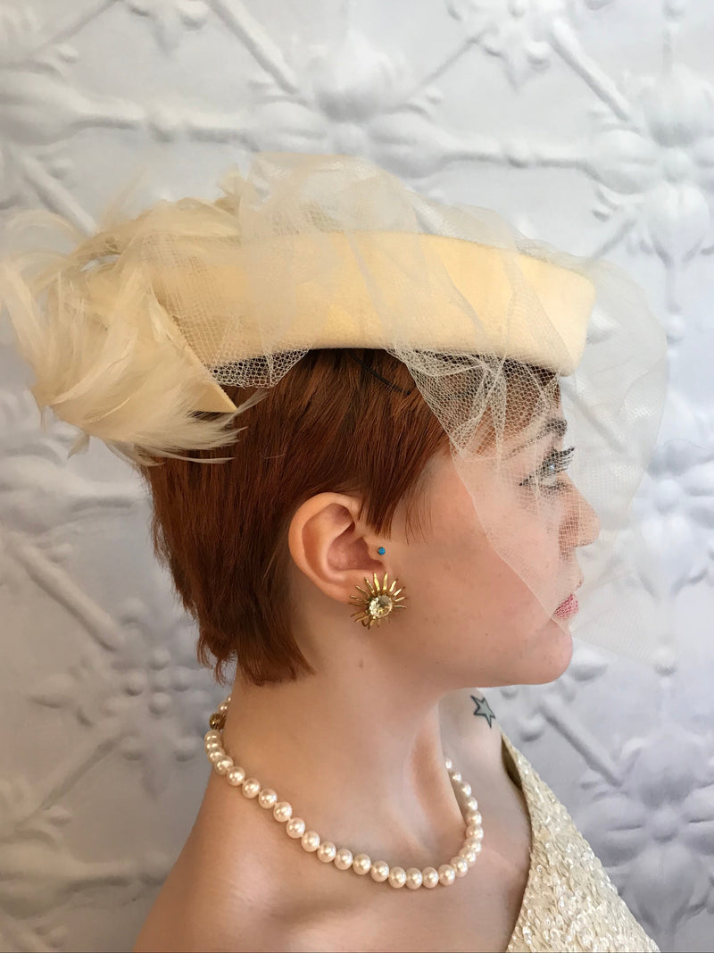Model wearing pearl necklace with a textured white background