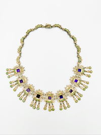 Matl sterling silver necklace laid flat with articulated gemstone fringe