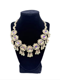 Statement vintage Matl necklace on a black mannequin bust with a white background