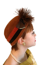 Side view of vintage Schiaparelli Paris velour cocktail hat with feather pom