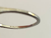 Close-up of maker's mark and 18K stamp